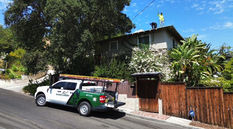 Green Ladder Roofing crew and truck on a foothill roof replacement, GAF Master Elite contractor